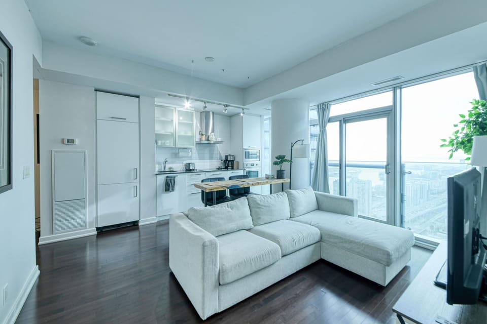 Deluxe Suite, 2 Bedrooms, 2 Bathrooms, City View | Living area | 50-inch flat-screen TV with digital channels