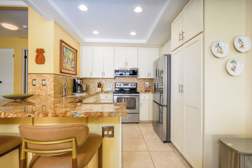 Beautiful renovated kitchen with fridge, stove, oven, dishwasher, microwave, coffee maker, toaster and many more