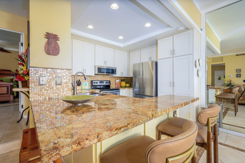 Beautiful renovated kitchen with fridge, stove, oven, dishwasher, microwave, coffee maker, toaster and many more