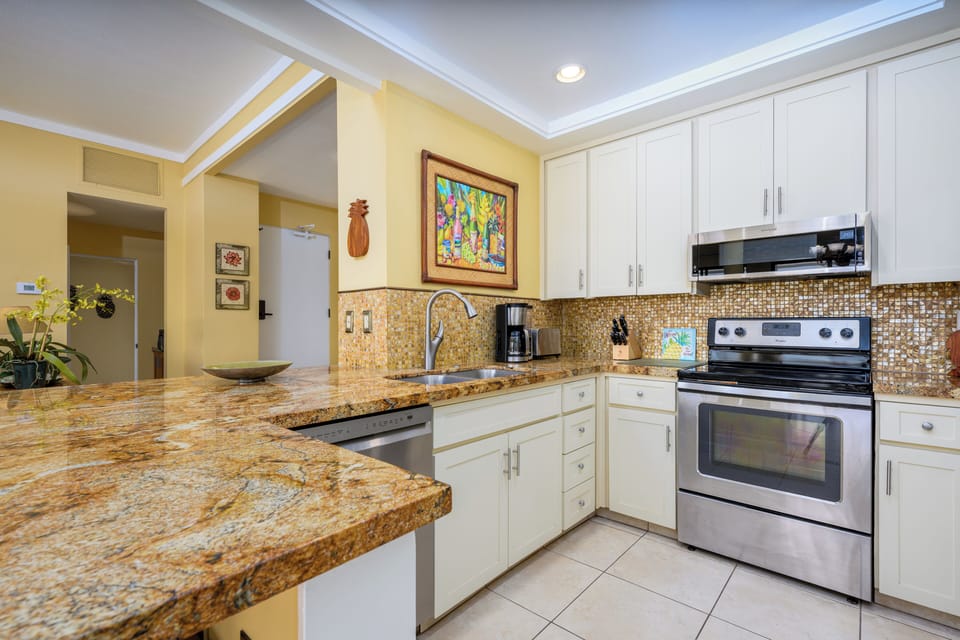 Beautiful renovated kitchen with fridge, stove, oven, dishwasher, microwave, coffee maker, toaster and many more