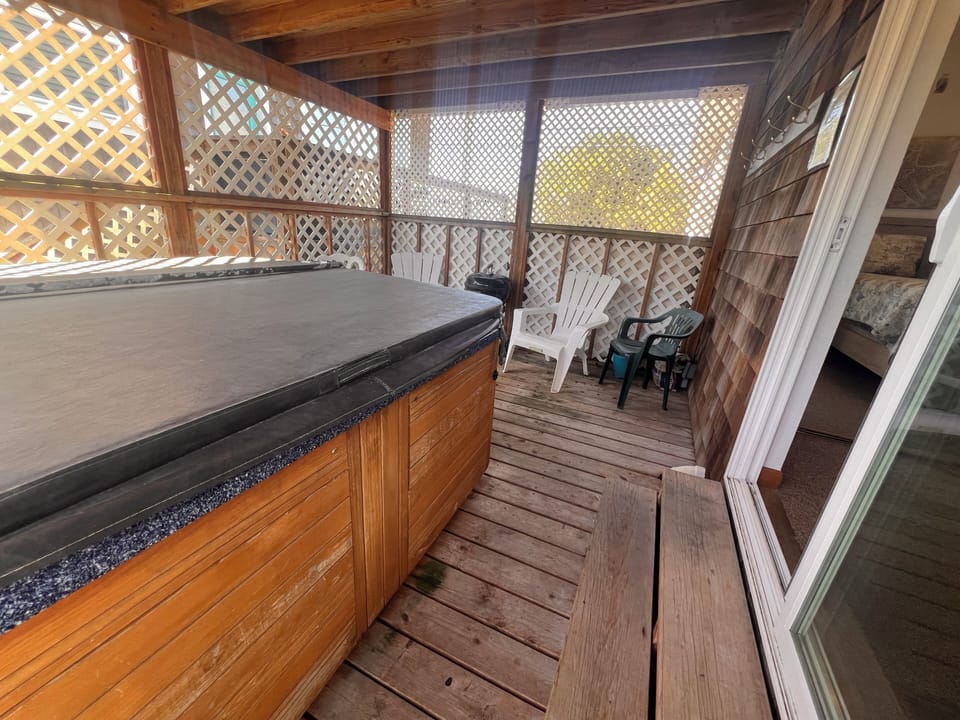 Your private deck offers warm wood details and lattice railings, creating a cozy outdoor retreat