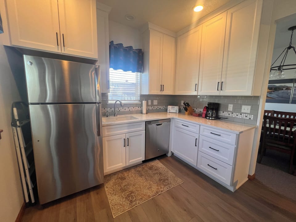 Your fully equipped kitchen features stainless steel appliances, granite countertops, and ample cabinet storage for all your culinary adventures.