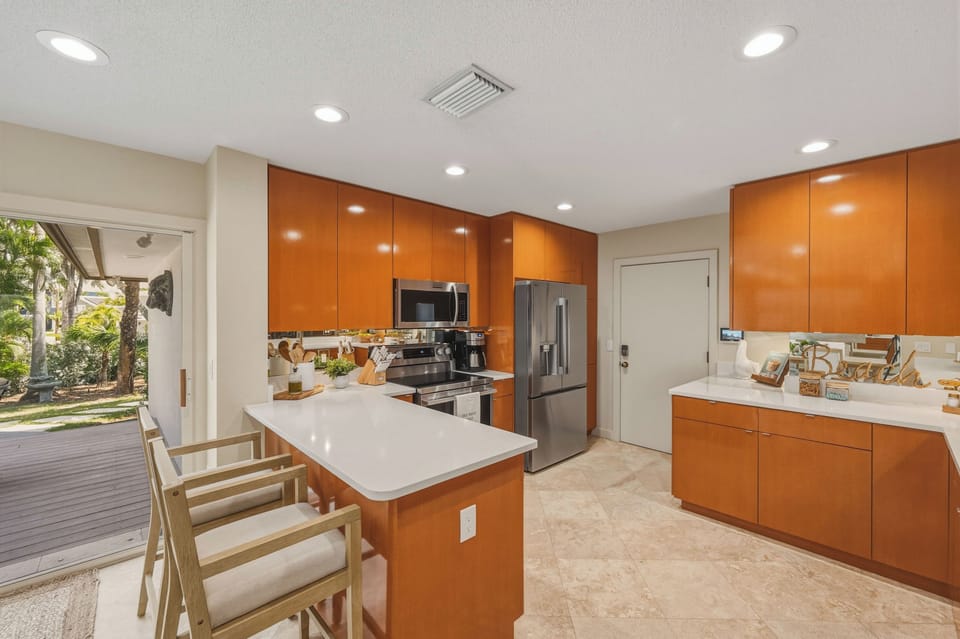 Your sleek modern kitchen features premium appliances and a breakfast bar where you'll start each morning with coffee and planning adventures.