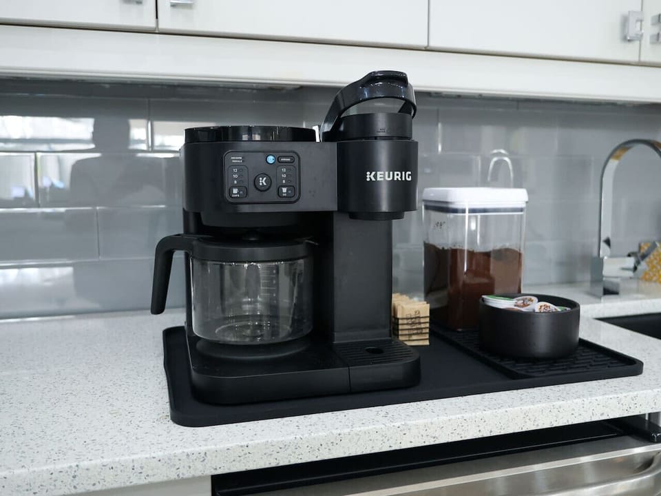 Start the day with ease using the convenient coffee setup, including a dual Keurig machine for single-serve or full-pot brewing.
