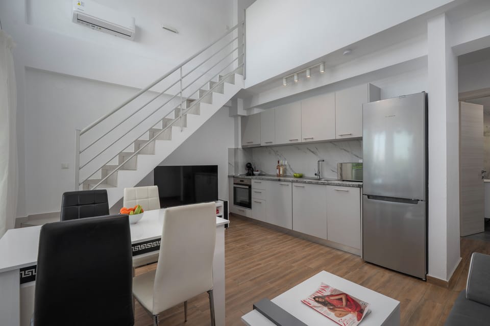 Deluxe Apartment | Living area | 40-inch TV with cable channels