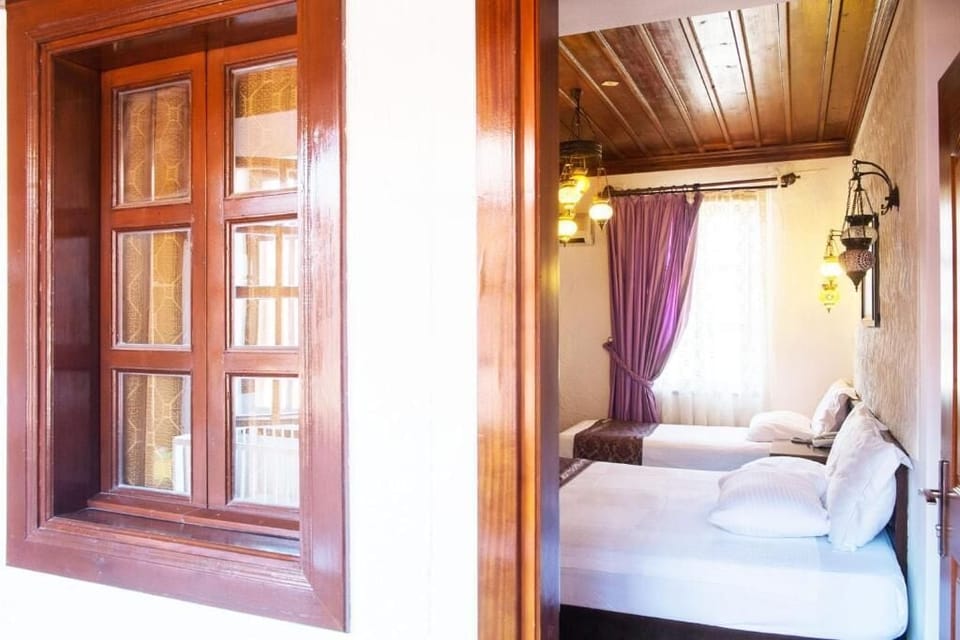 Standard Triple Room, Patio, Garden View | In-room safe, blackout drapes