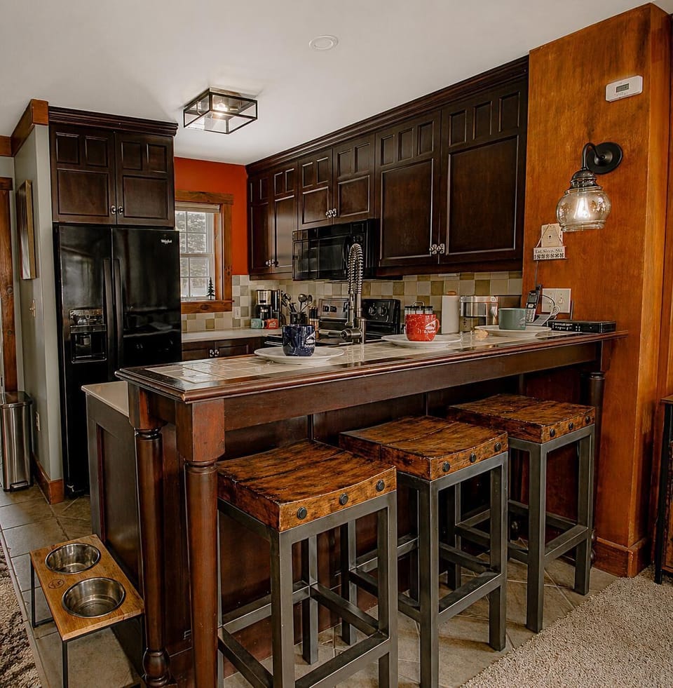 The comfortable, fully stocked kitchen is perfect for preparing meals or quick snacks.