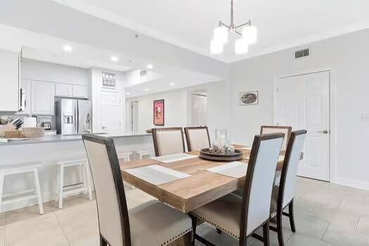 Fully stocked kitchen at Harbour Point 301 with high-quality cookware, modern appliances, and barstool seating—perfect for families who love to cook during their Perdido Key vacation.