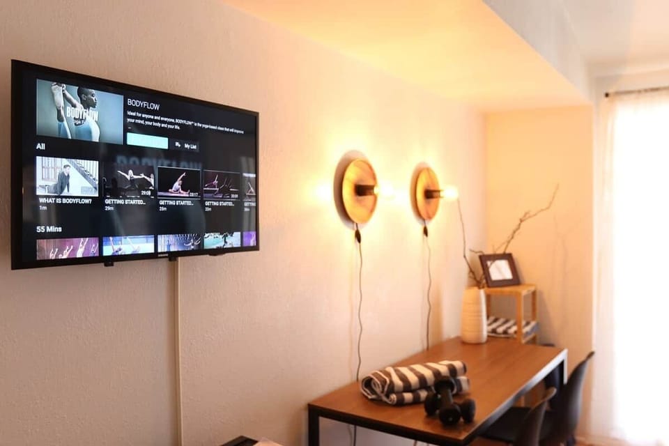 Work out and desk area, includes printer, weights, yoga mat and access to on-demand exercise classes