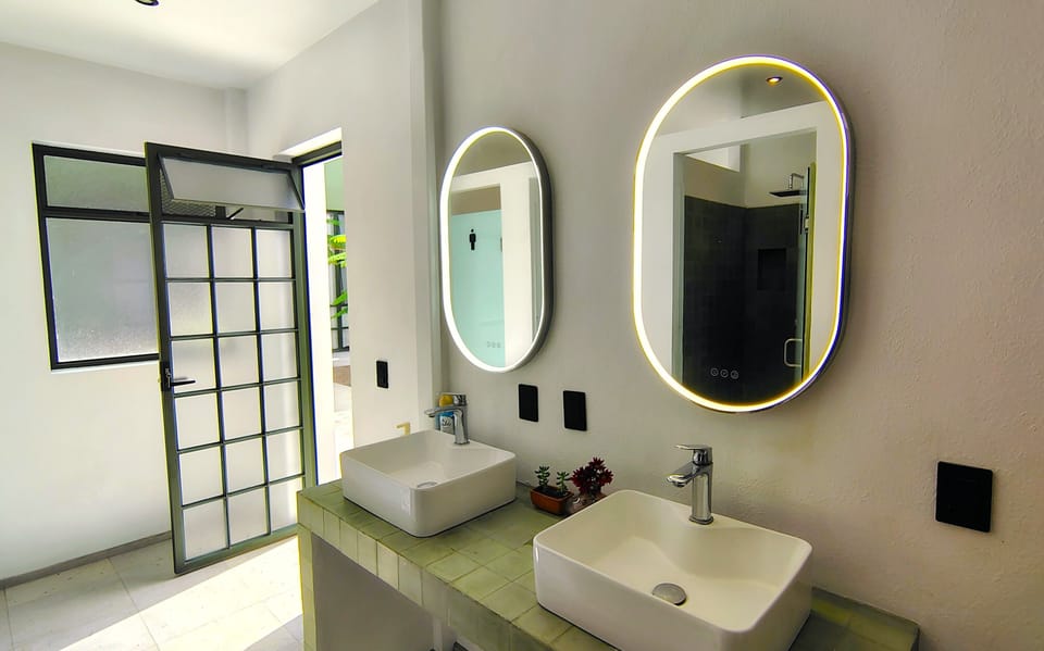 Bed in Mixed 10-Bed Dormitory | Bathroom | Shower, hair dryer, towels, soap