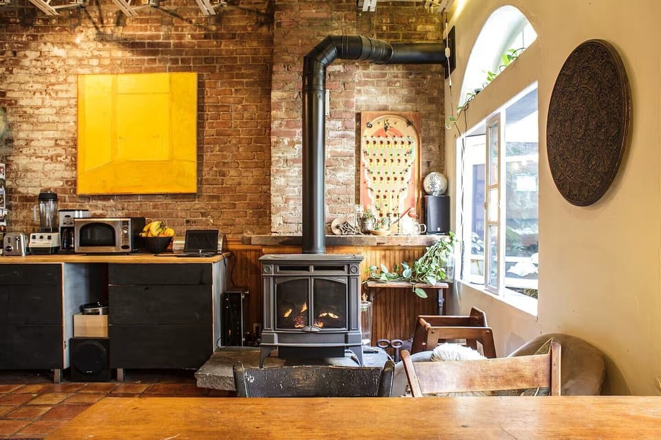 The gas fireplace is controlled by a thermostat by the door. (Windows screened)