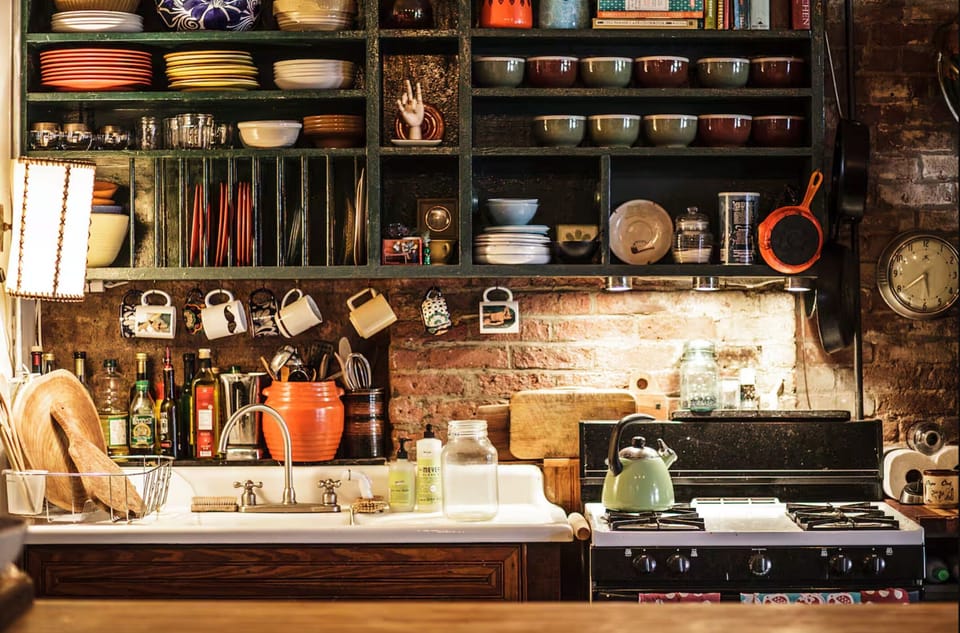 Farm sink, gas stove, dishwasher, bright and abundant cooking utensils...