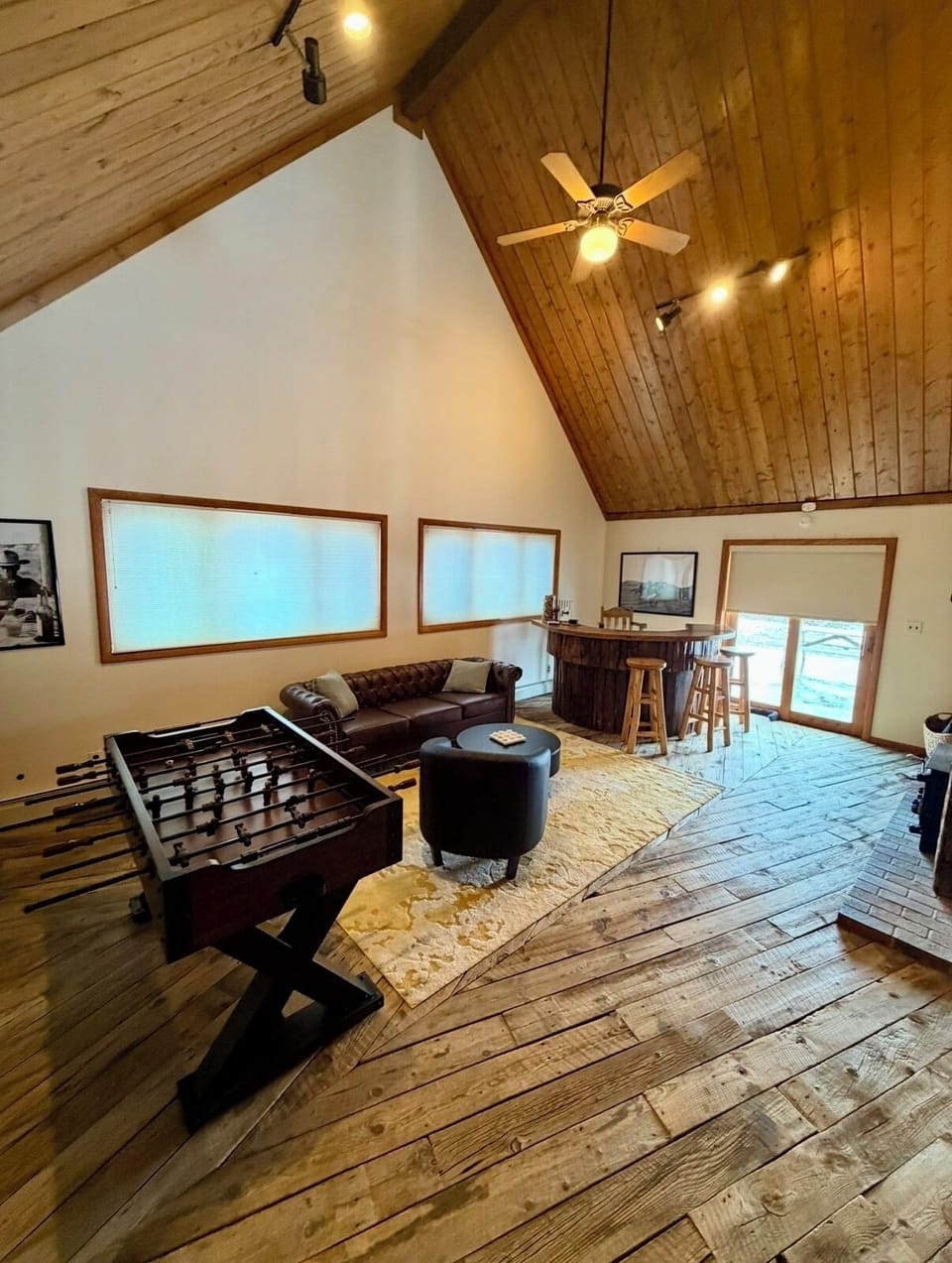 Games Room with foosball table, bar, chesterfield couch, boardgames & books