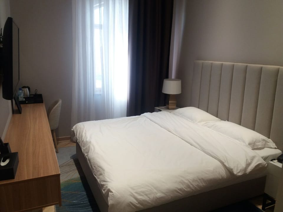 Standard Double Room, City View | Laptop workspace, WiFi (free), bed sheets