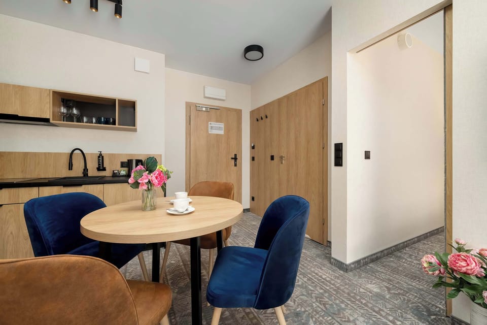 A kitchen area with a coffee machine and countertop appliances. The space is well equipped for everyday comfort.