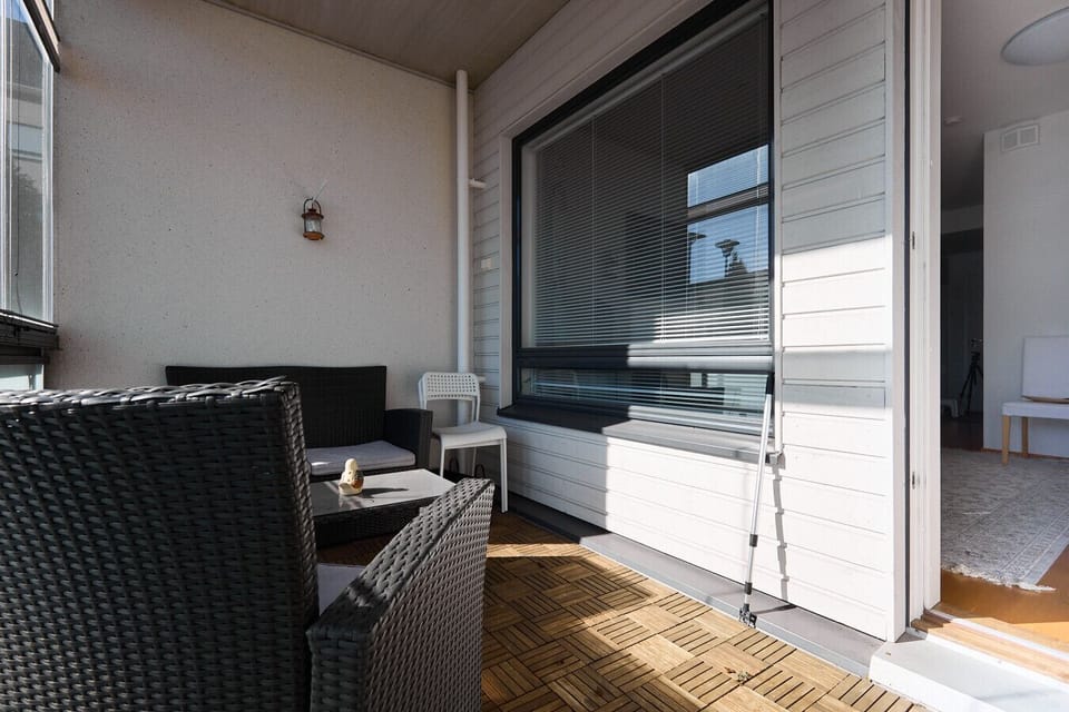 Large sliding glass doors connect the living room to the balcony, seamlessly extending your living space. The glazing can be opened or closed to suit your preference and the season.