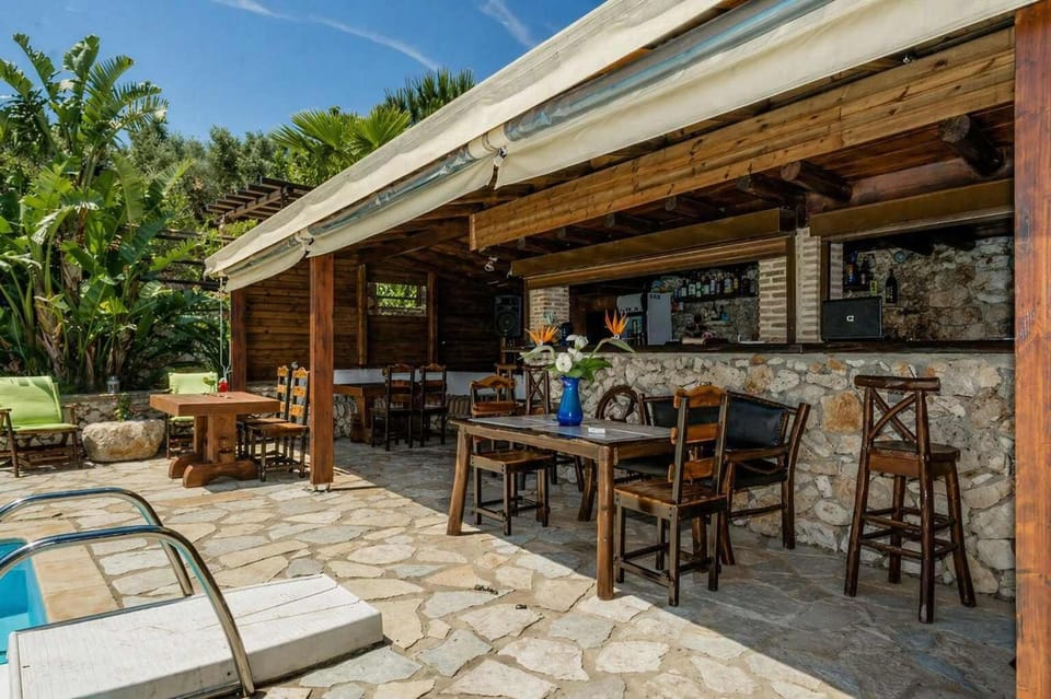 Covered Outdoor Bar at the premises with Rustic Design