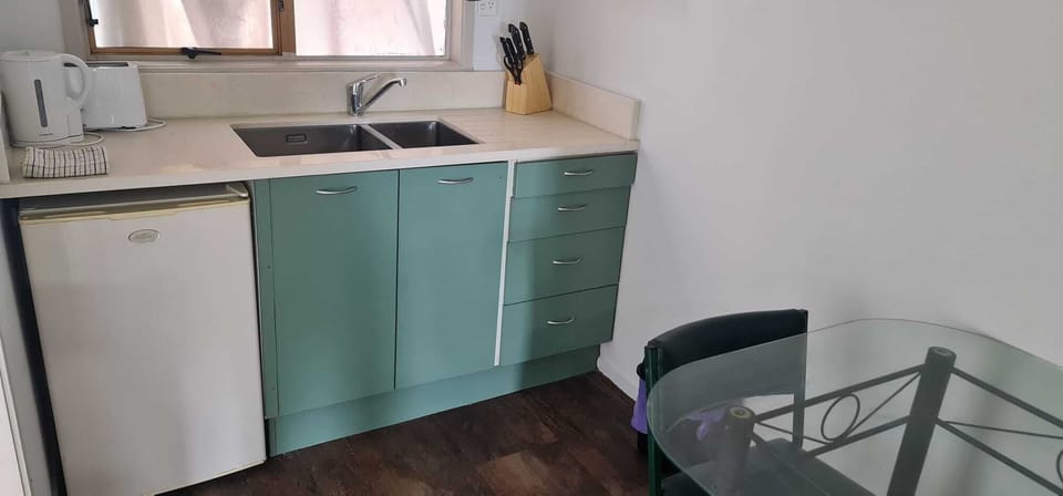 Mini-fridge, microwave, cookware/dishes/utensils
