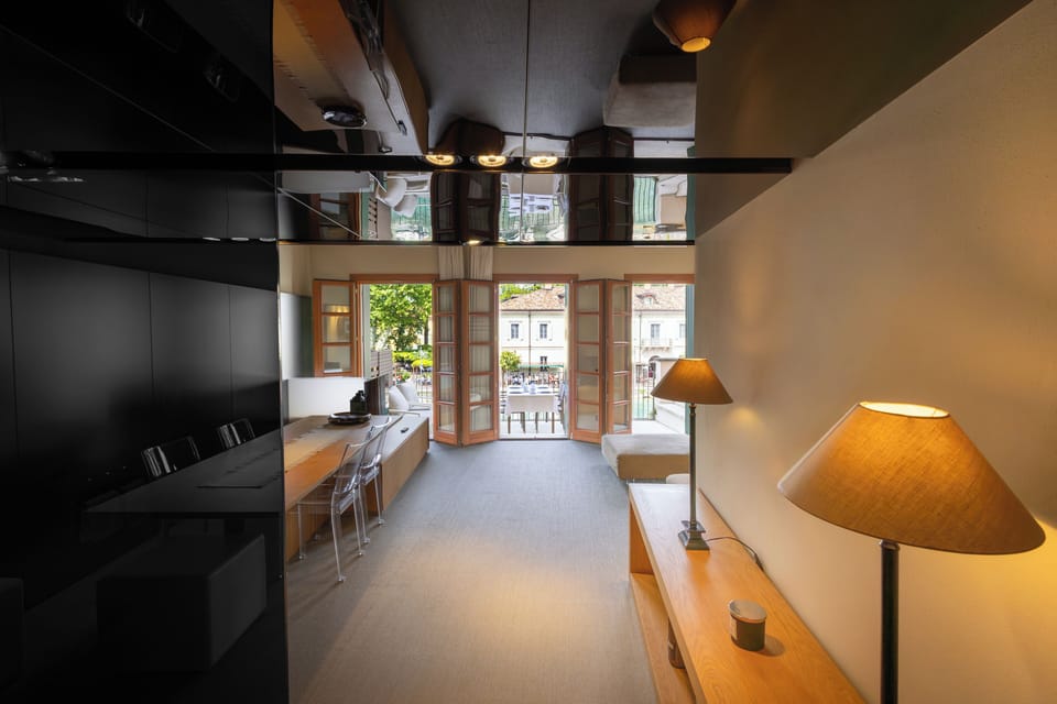 Deluxe Apartment, Balcony, Lake View | Living area | Flat-screen TV