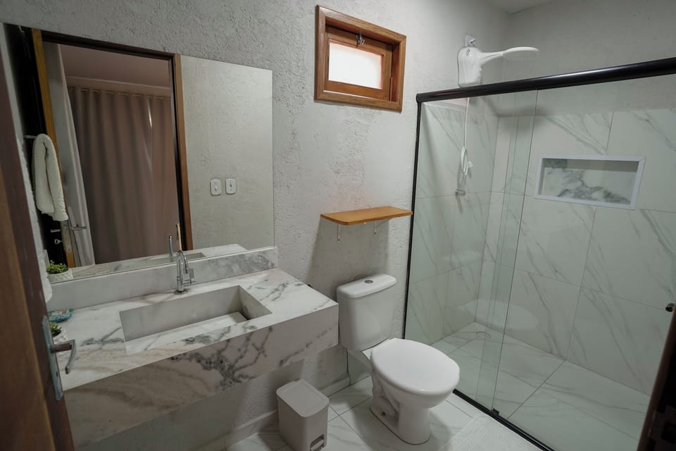 Hair dryer, towels, shampoo, toilet paper