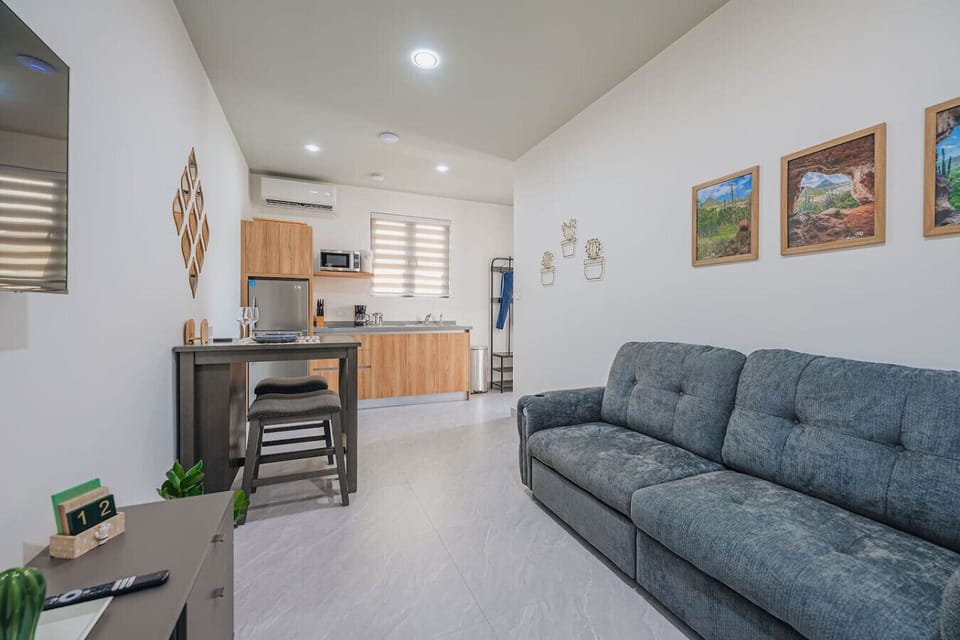 Spacious modern bedroom with king bed, natural light, and garden views for a calm, luxury retreat vibe.