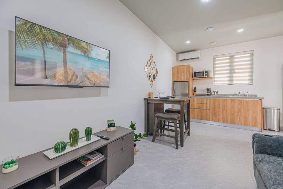 Luxury bedroom with king bed, accent wall & modern wood accents ideal stay.