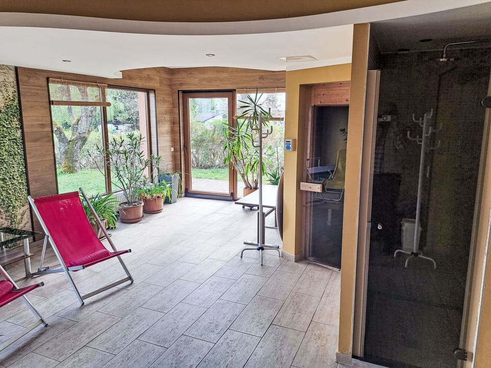Wood, Flooring, Floor, Interior Design, Door, Chair, Wood Stain, Houseplant, Glass, Hardwood