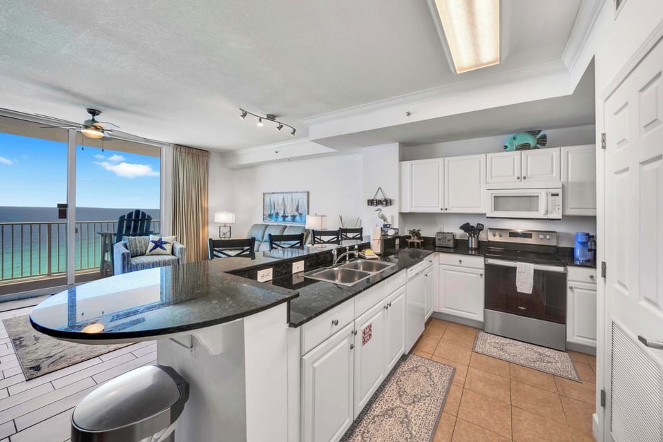 The fully equipped kitchen features granite countertops and has everything you need to prepare meals for family & friends.