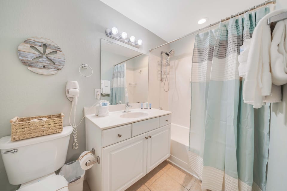 The ensuite bathroom features a tub/shower combo.