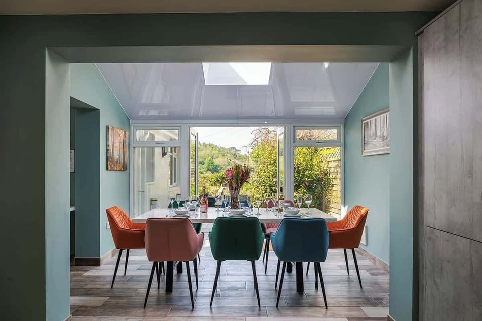 Beautiful light and airy dining room with patio doors to the outside