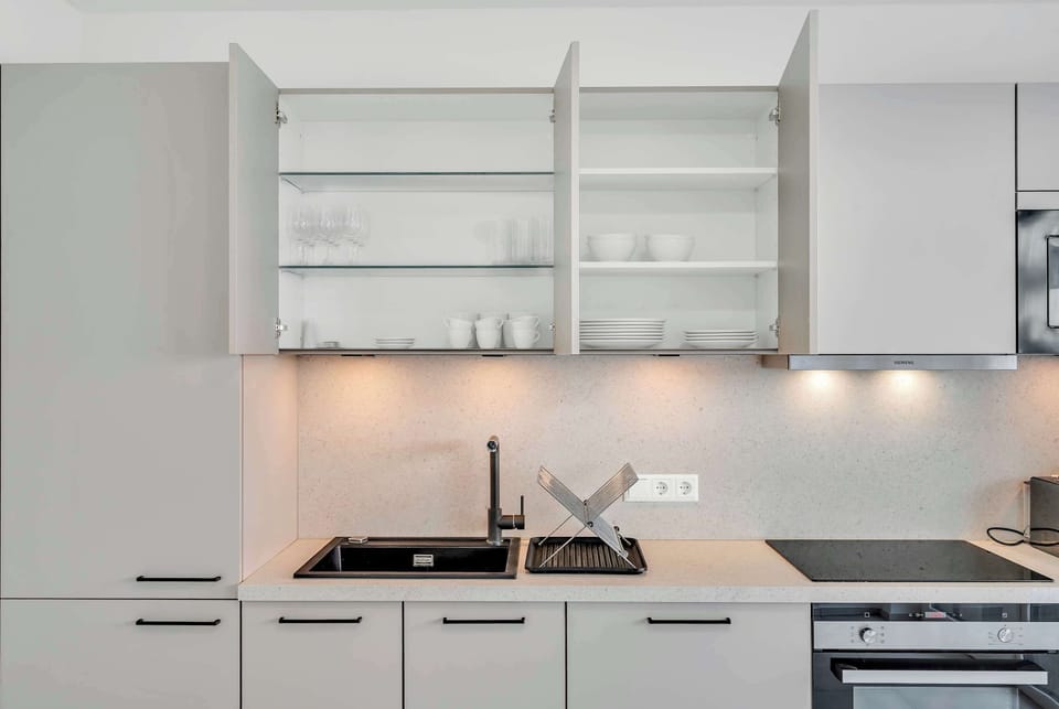 Modern kitchen with open shelving and practical layout for everyday use.