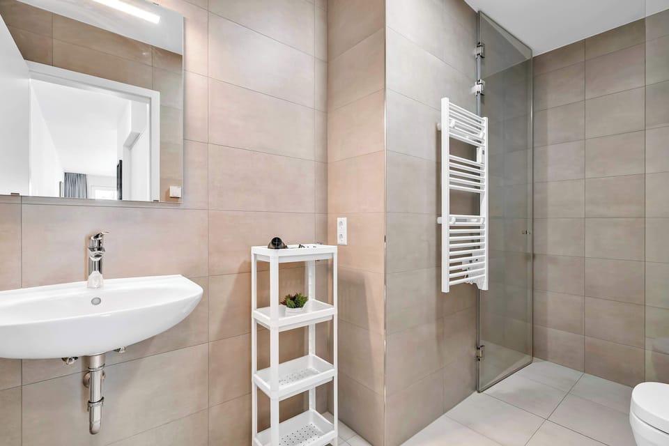 Modern bathroom with walk-in shower and practical layout for everyday comfort.