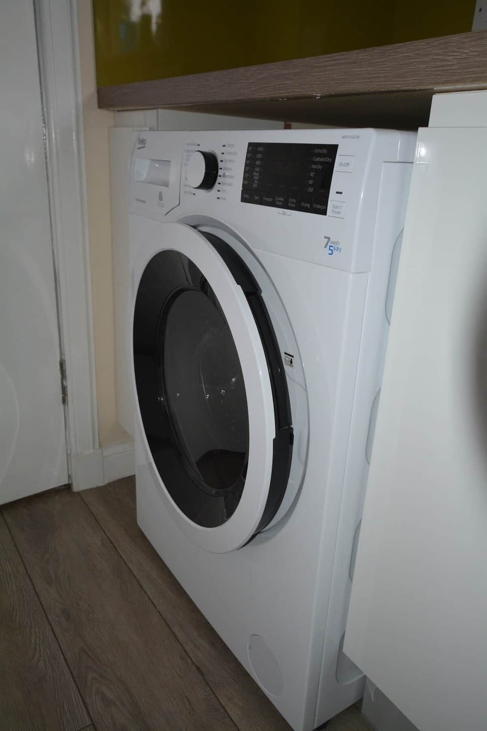 Washer and Drier. There's a shared drying green to the rear. Clothes pegs and additional drying racks are in the Hallway Store Cupboard. 