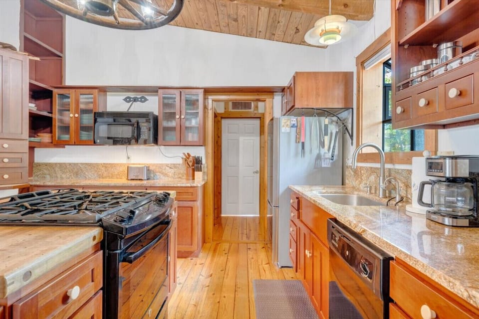 Put your culinary skills to the test in the beautiful kitchen with granite countertops & gas stove.