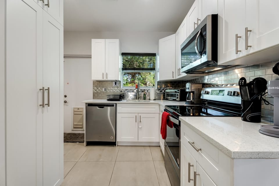 Modern cabinetry stocked with all the essentials you need for a home-cooked meal.