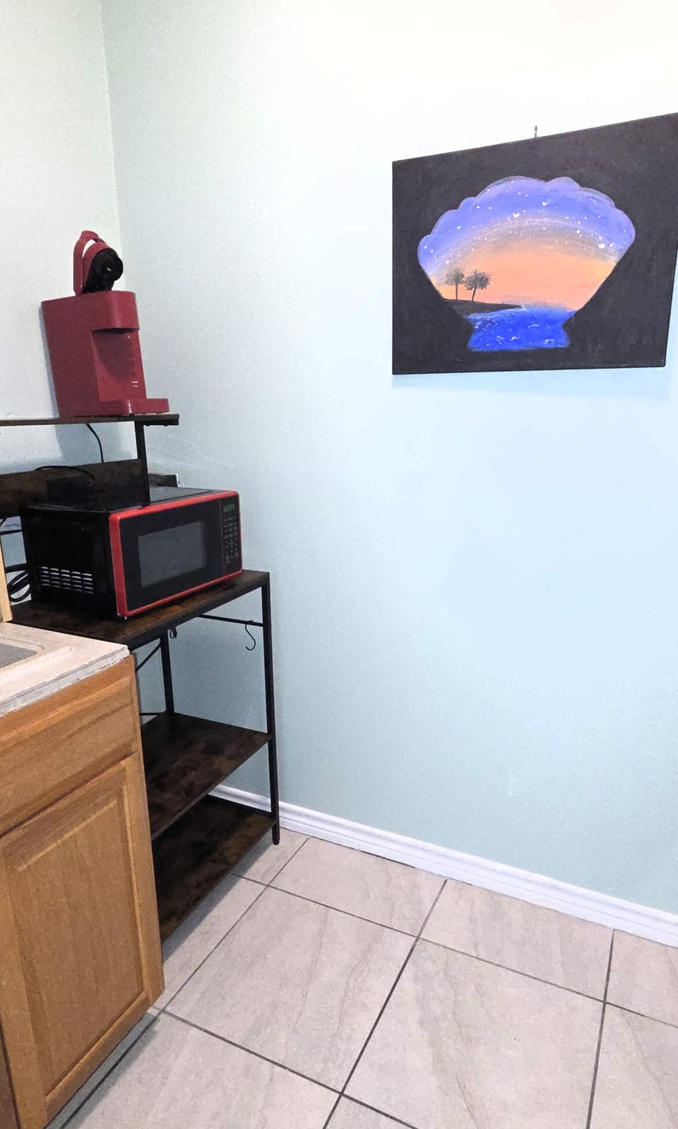 The kitchen has a microwave and Keurig coffee maker.