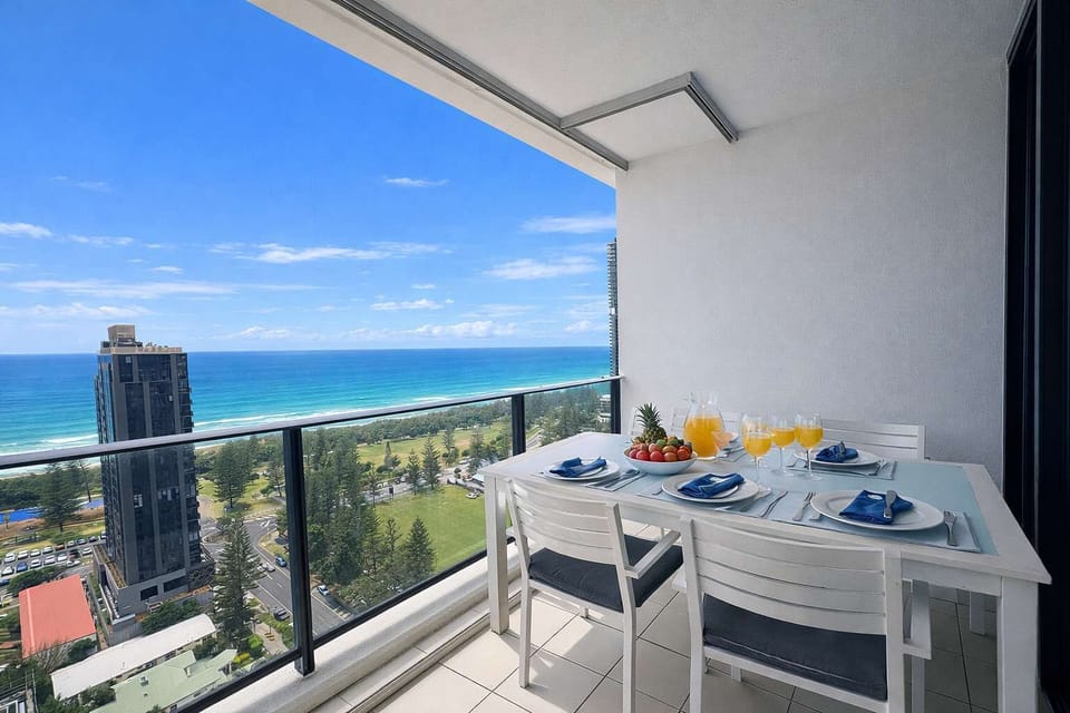 Balcony dining with sweeping coastal views