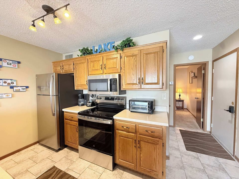 The open kitchen offers ample space & all the comforts of home​