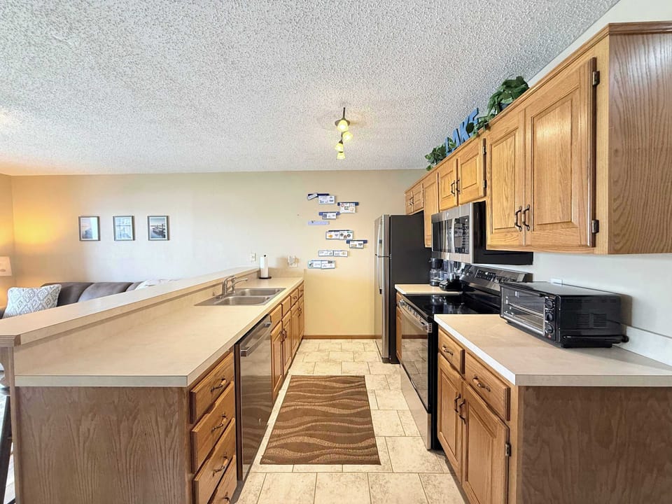 The open kitchen offers ample space & all the comforts of home​