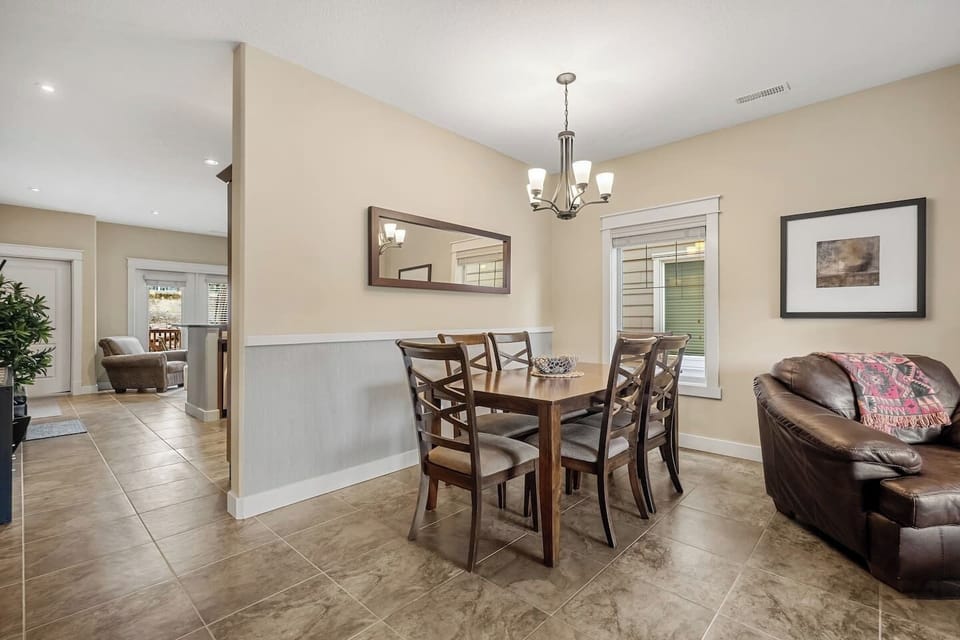 Dining area with seating for 6 at the table and 3 at the island.