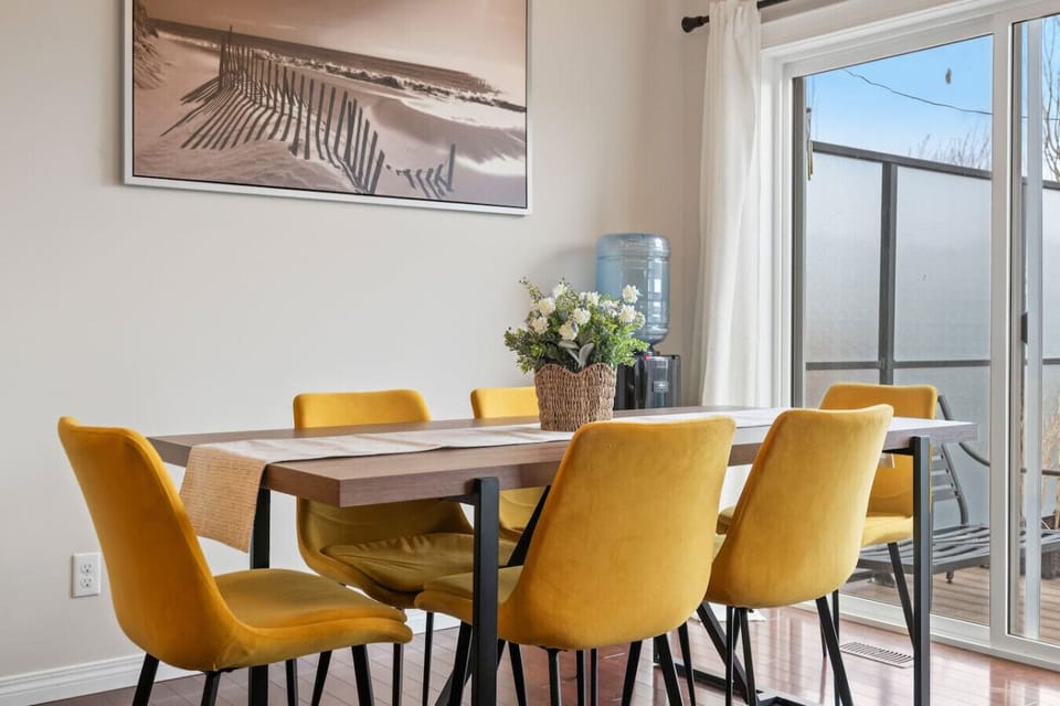 Dining area with seating for 6 at the table and 2 at the island.