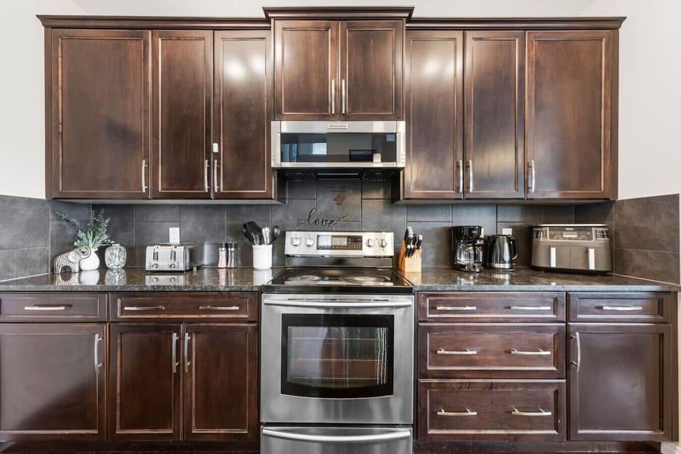 Full kitchen with a drip coffee machine, ground coffee, tea, sugar and basic condiments (ketchup, mustard and relish.)