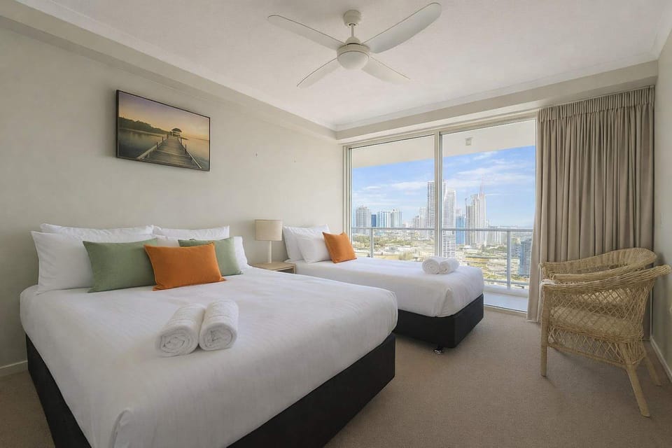 Bright bedroom with queen and single beds