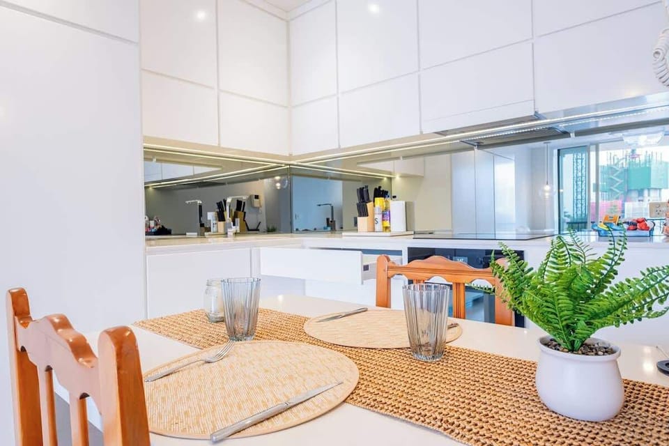 Kitchen and Dining: Modern kitchen with a cozy dining setup for meals and gatherings.