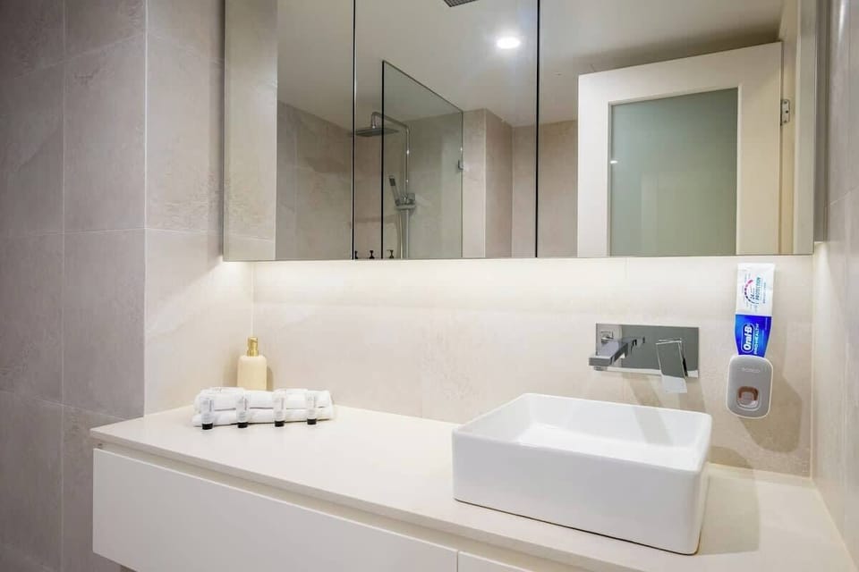 Vanity: Luxurious bathroom vanity with bright lighting and stylish fixtures.