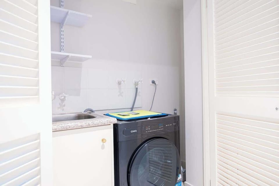 Laundry Facilities: In-unit laundry with washer, dryer, and extra storage space.
