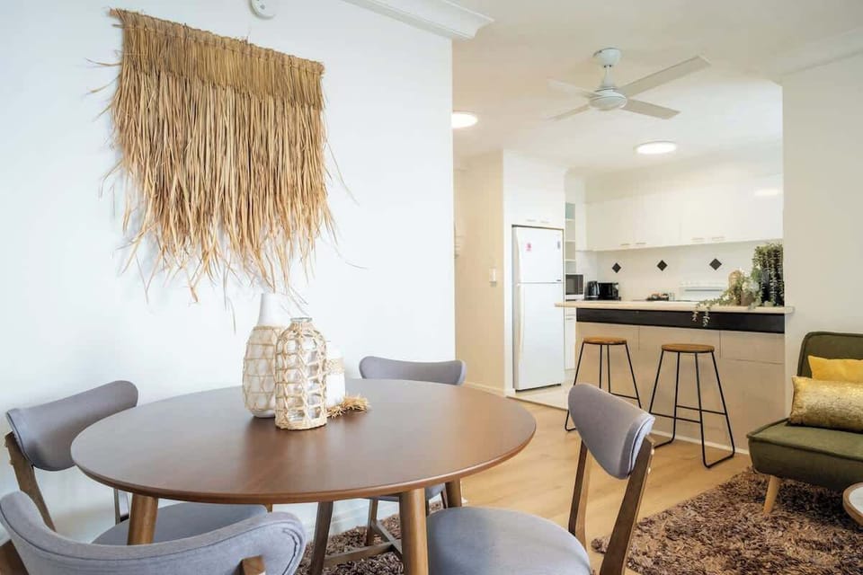 Dining Area with Natural Touches – Enjoy meals in a cozy dining space accented with boho-chic decor and warm lighting.