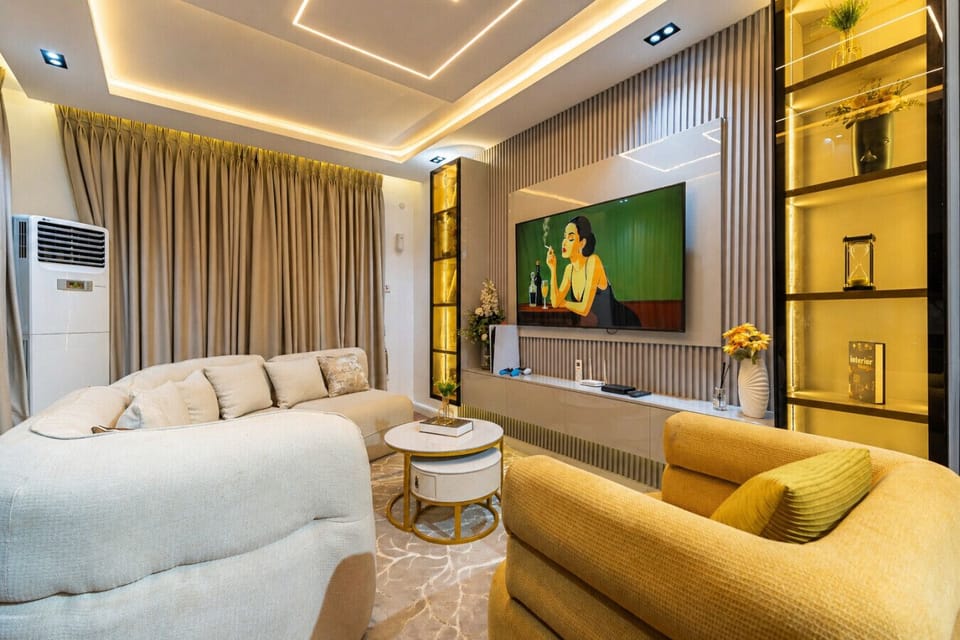 Relax in a spacious and modern living room designed for comfort, perfect for unwinding after a long day or enjoying quality time during your stay.