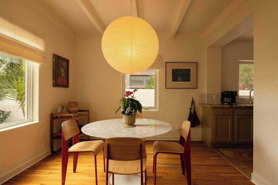 An open-concept flow into the kitchen makes this the ideal spot for intimate dinners or your morning coffee ritual.