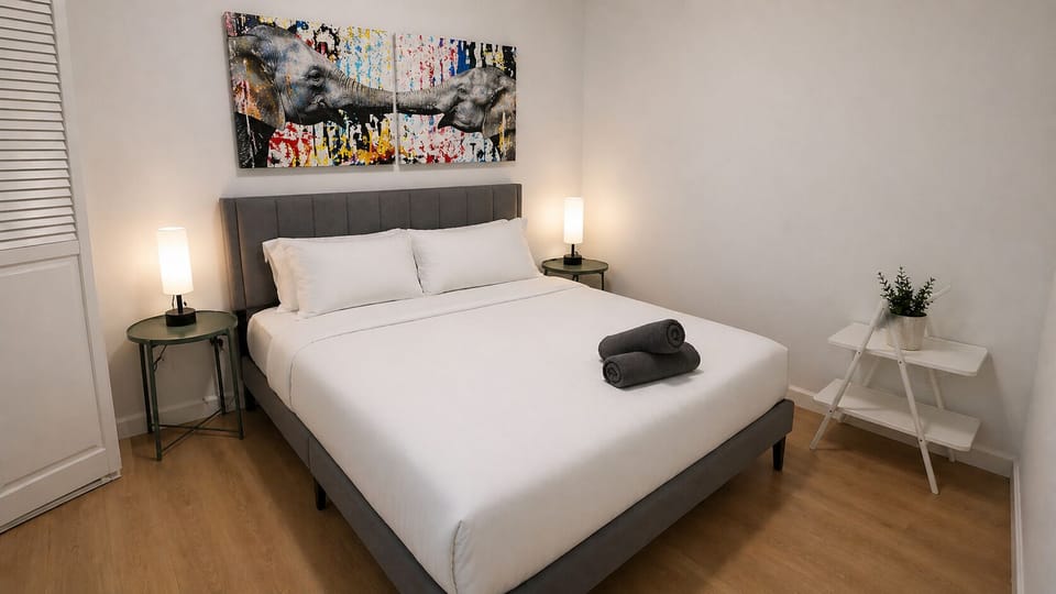 A cozy room with a comfortable queen bed, perfect for a restful stay